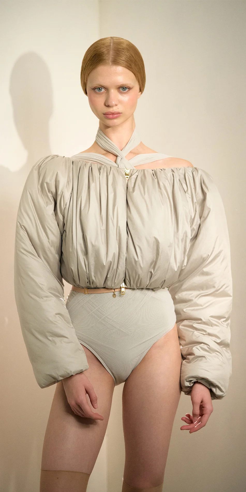Cropped boatneck puffer jacket in sage green front arms down