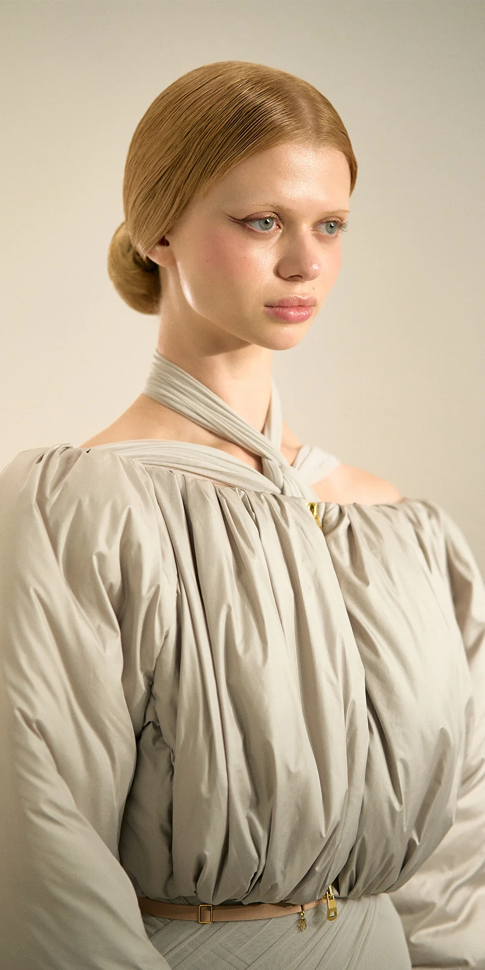 Cropped boatneck puffer jacket in sage green side portrait