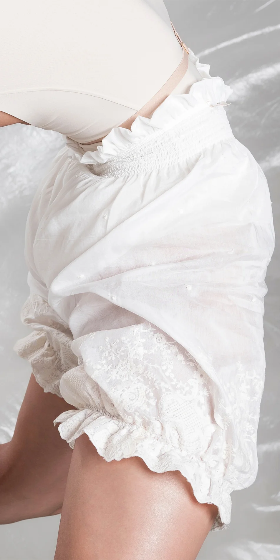 Cotton silk embroidered bloomers in cream backbend close up