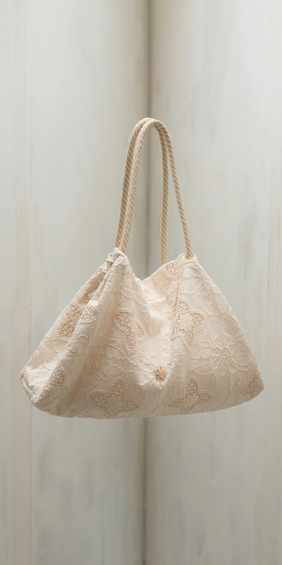 Embroidered cotton tote in cream floating