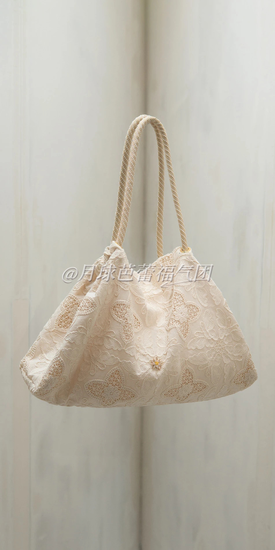 Embroidered cotton tote in cream floating