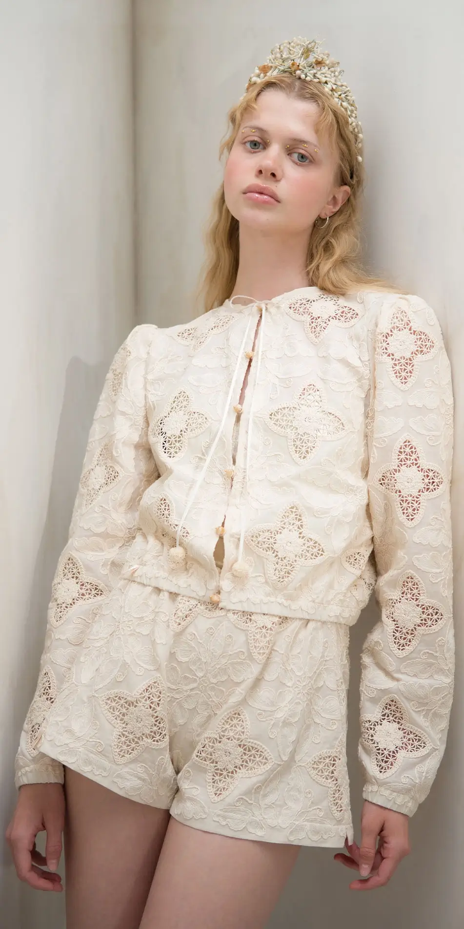 Round neck embroidered cotton jacket in cream front cropped leaning