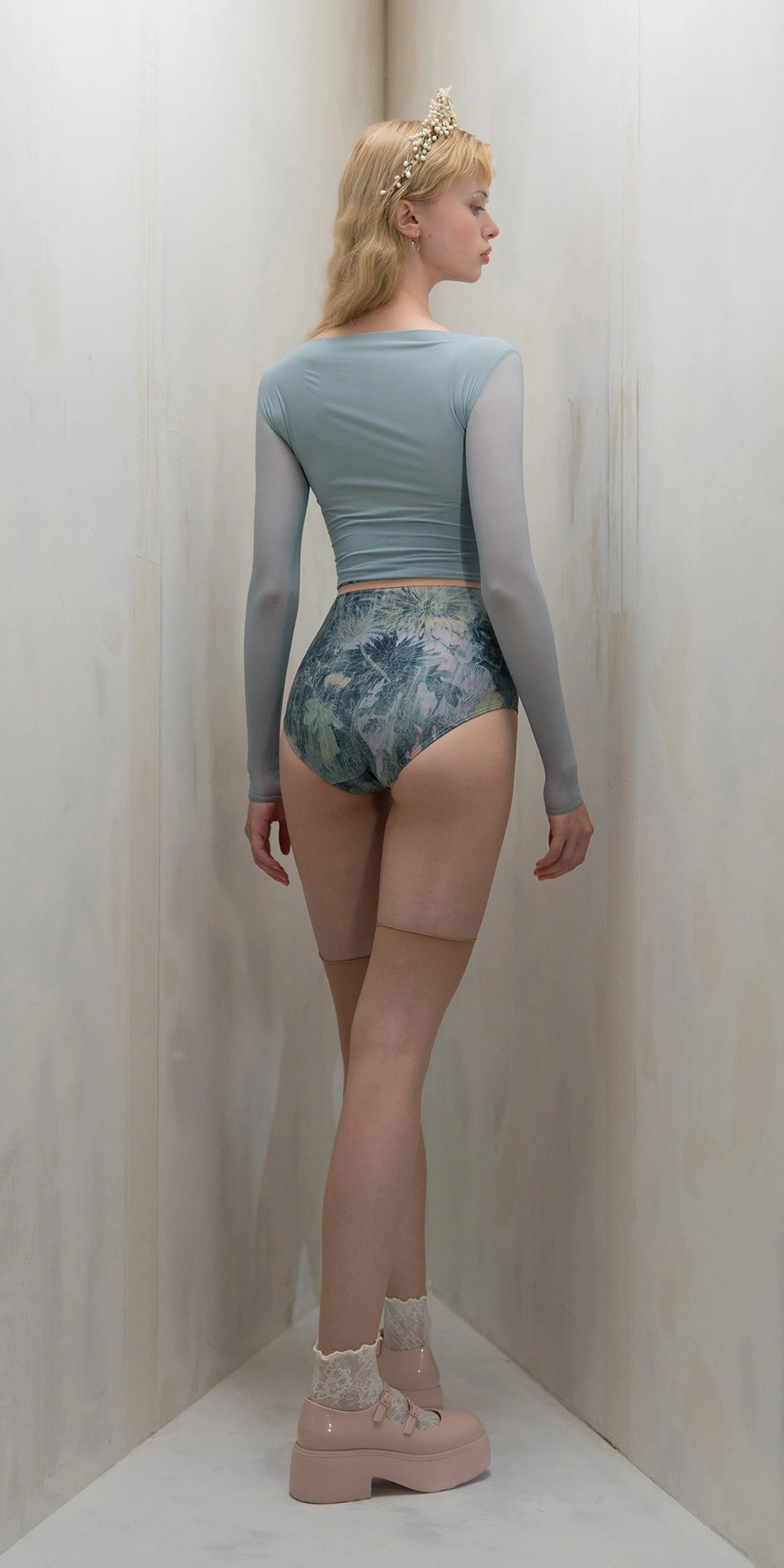 Sheer crop top with rhinestuds in light blue full body back