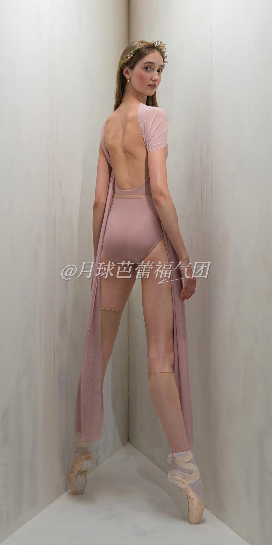 Halter scarf leotard in dusty pink back en pointe looking over shoulder