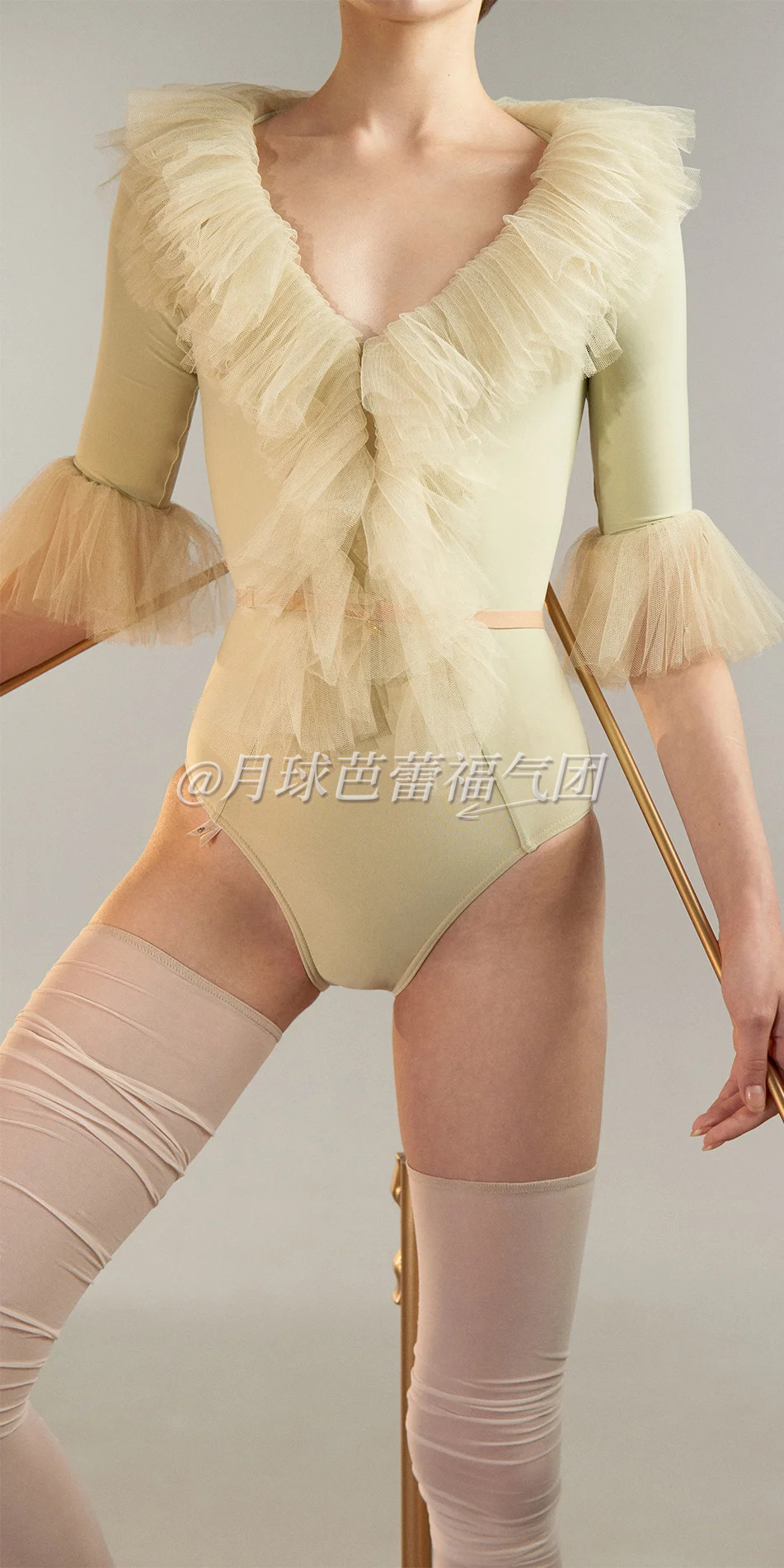 03_Tulle-decollete-leotard-with-sleeves-green-tea-cropped-front-view-detail.webp
